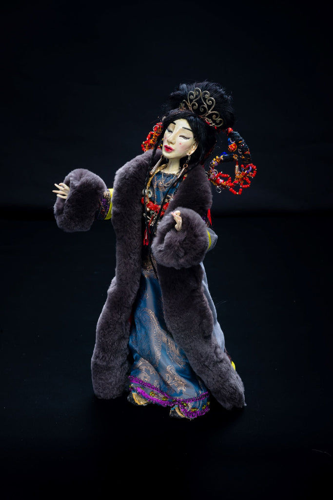 Doll in a fur coat